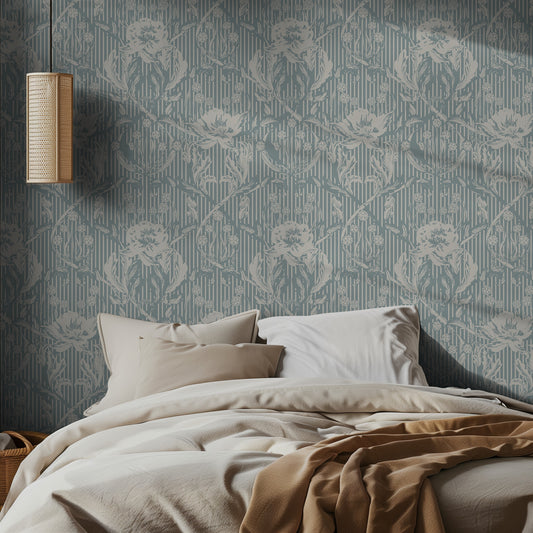 Bedroom with light teal floral patterned wallpaper and soft bedding