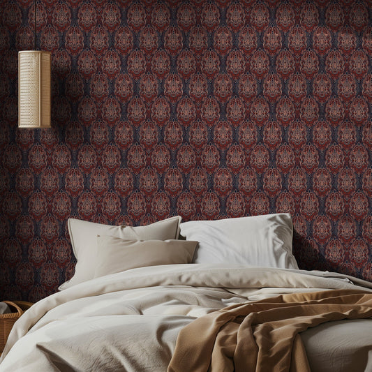 Bedroom with red damask patterned wallpaper and beige bedding