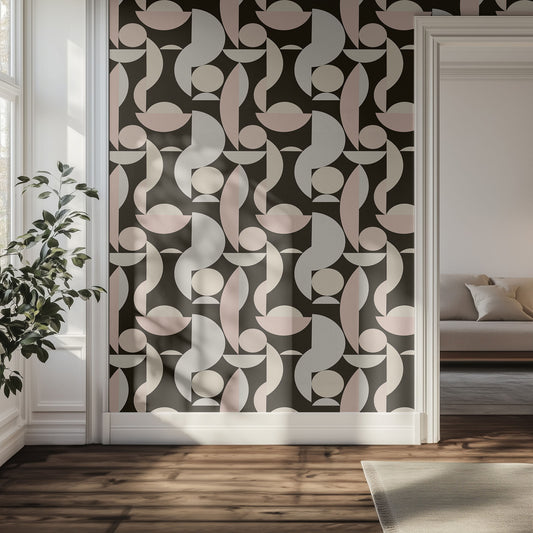 Hallway with neutral and black geometric patterned wallpaper, plant, and sofa.