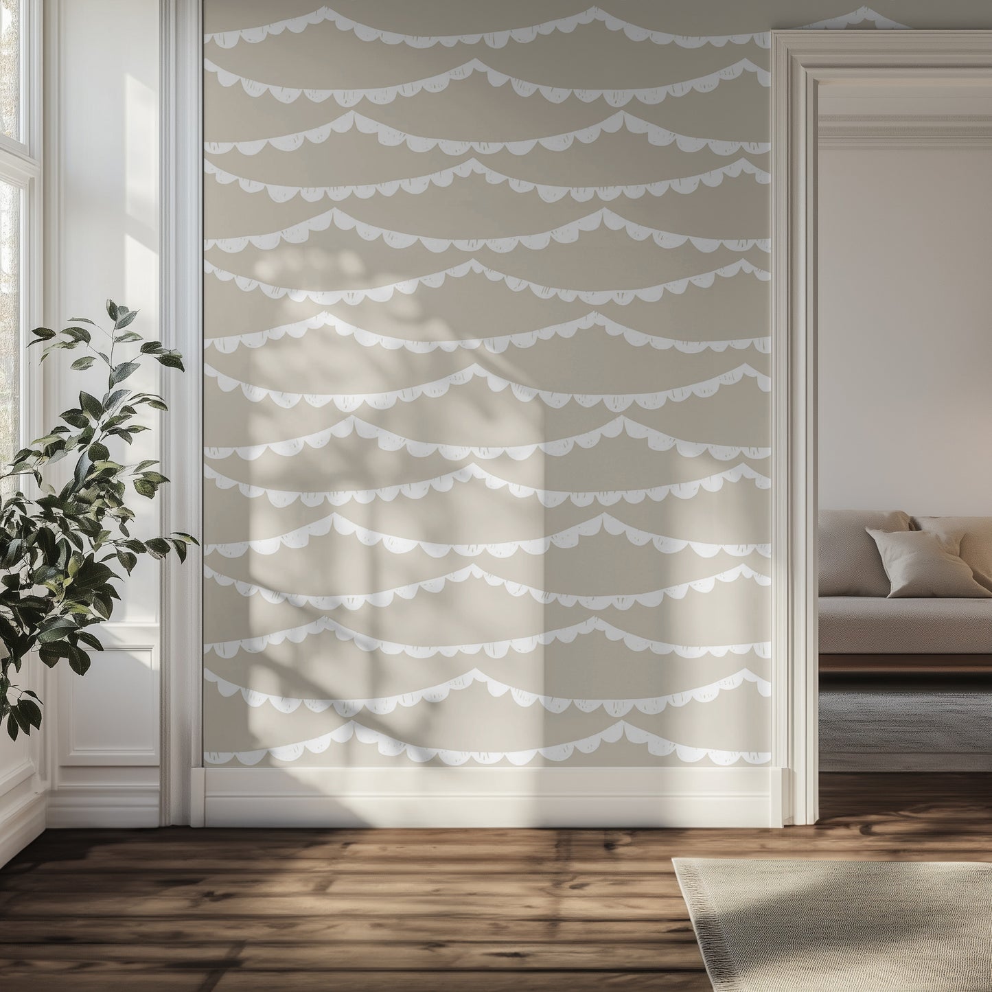 Hallway with beige with white scalloped wallpaper, plant, and sofa.