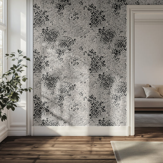 Hallway featuring black and beige chetah abstract pattern, light-colored sofa, and plant.
