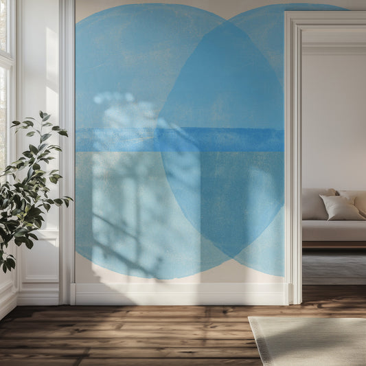 Modern interior with abstract blue circle artwork on a white wall