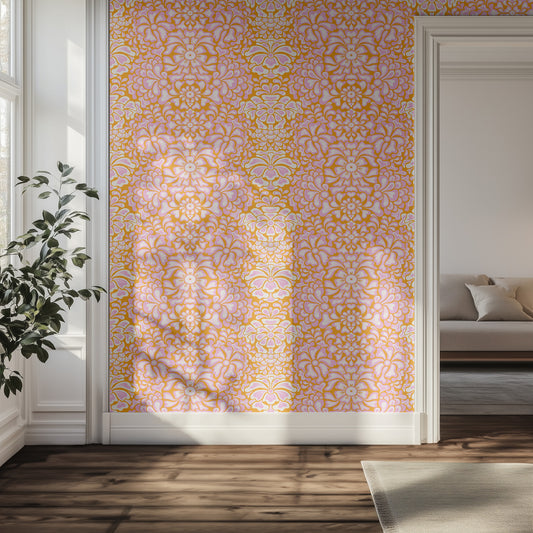 Hallway with bright pink and orange floral wallpaper, wooden floor, and a plant.