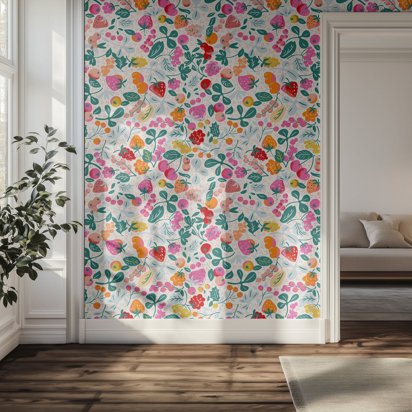 Colorful berries on wallpaper in a hallway with a couch and plant.