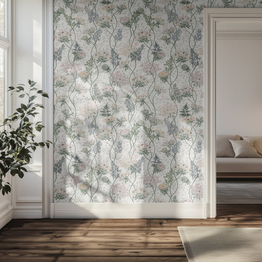 Room interior with delicate floral wallpaper, plant, and sofa.