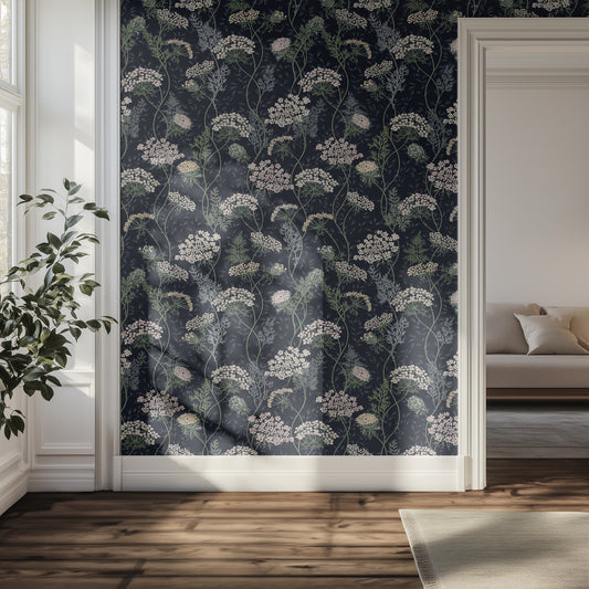 Hallway with navy blue and white floral wallpaper and a plant.