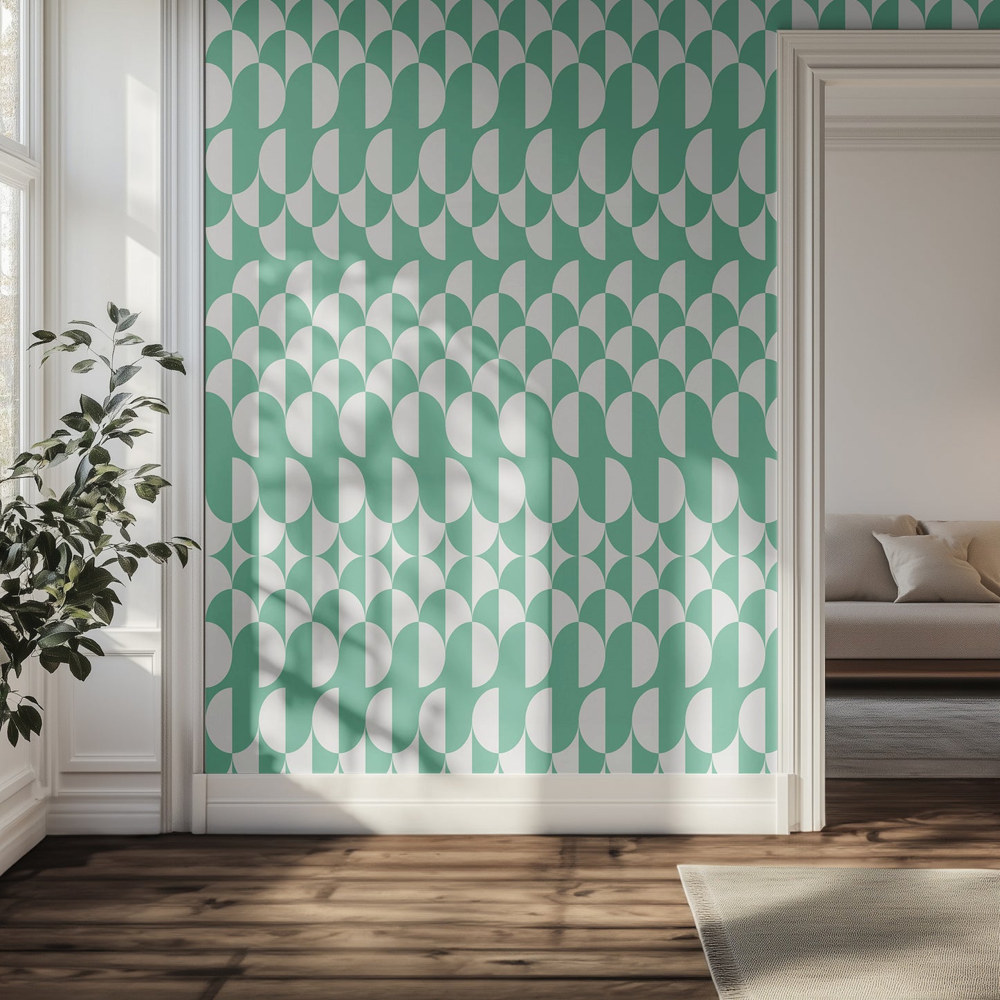 Hallway interior with a wall featuring a teal and white geometric pattern, a plant, and a sofa.