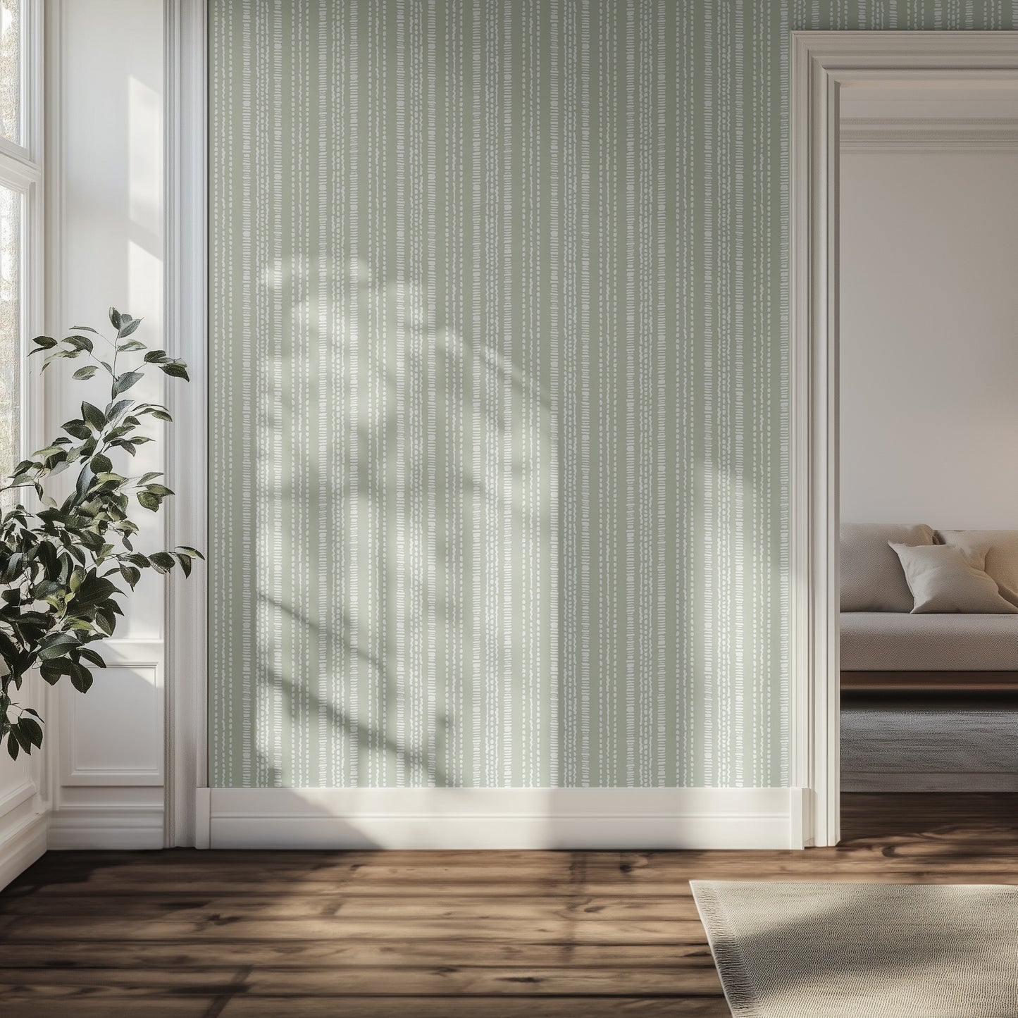 Living room with pastel green with white dotted striped wallpaper, wooden floor, and a plant.