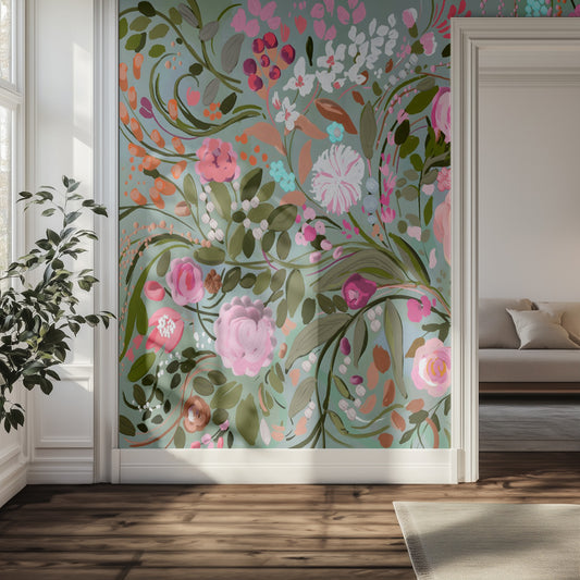 Floral wallpaper mural with pink and green flowers in a room with a couch and plant.