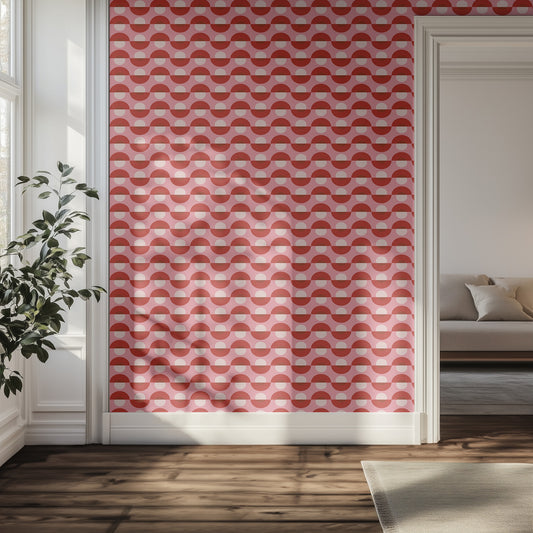 Hallway with pink retro patterned wallpaper, plant, and sofa.