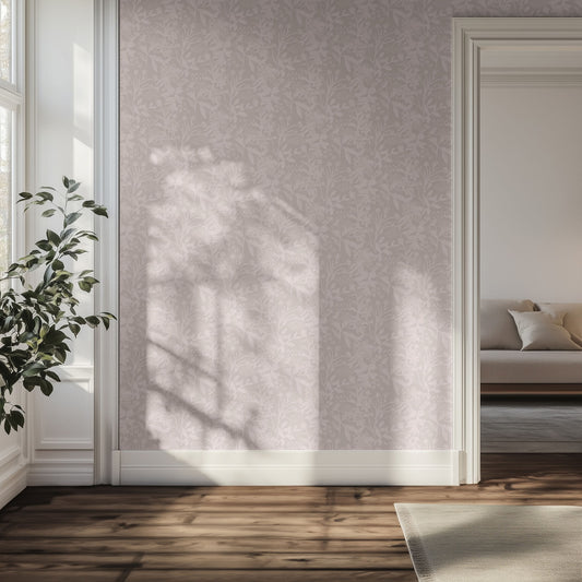 Living room with light purple and pink floral wallpaper, wooden floor, and a plant.