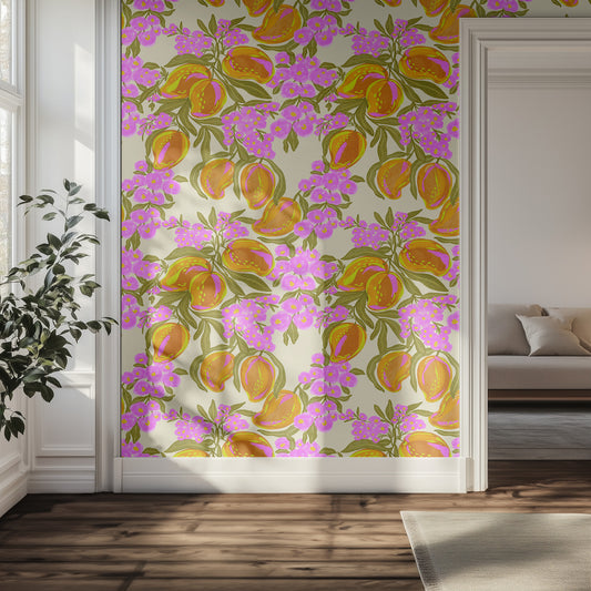 Floral patterned wallpaper with fruit and pink flowers in a hallway with a couch and plant.