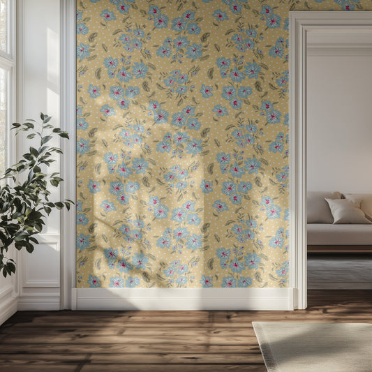 Floral wallpaper with blue flowers on a yellow background in a room with a couch and plant.