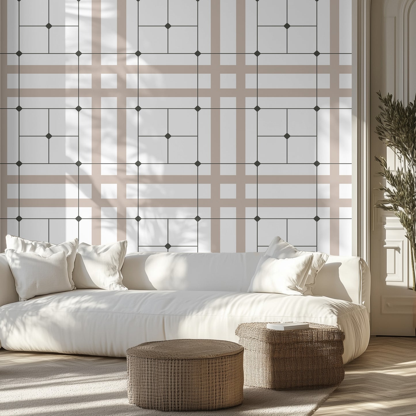 Modern living room with beige, white, and black sophisticated geometric grid wallpaper pattern, white couch, wicker ottomans.