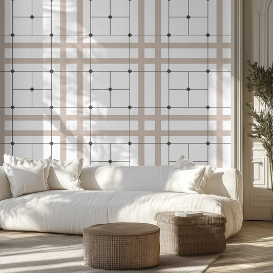 Modern living room with beige, white, and black sophisticated geometric grid wallpaper pattern, white couch, wicker ottomans.