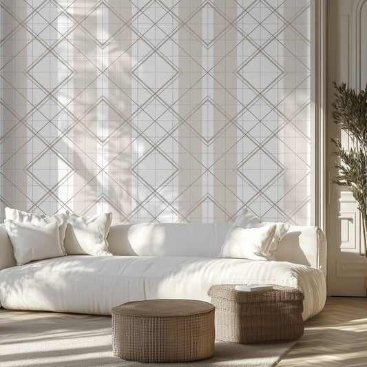 Modern living room with beige and white geometric wallpaper pattern, white couch, wicker ottomans.