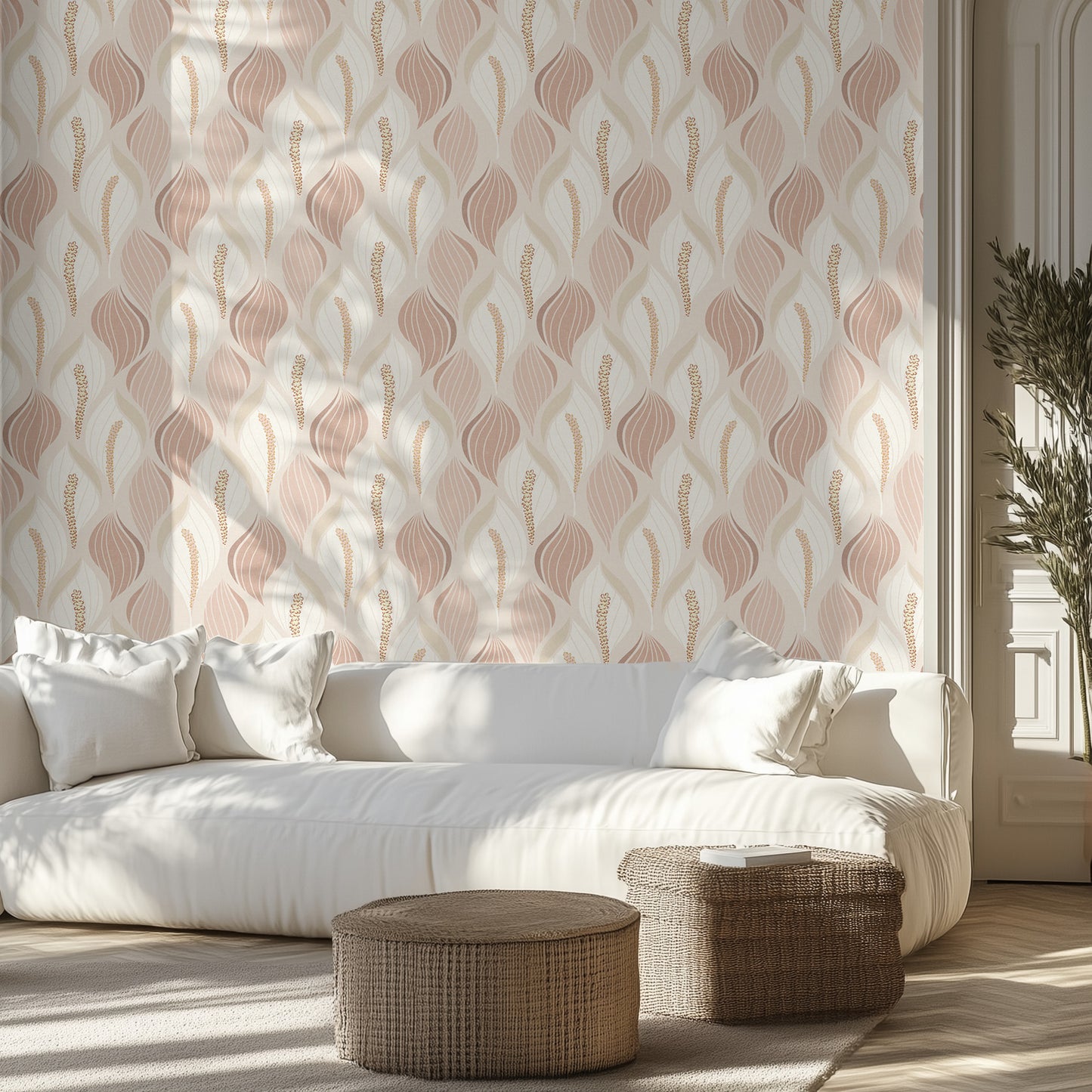 Modern living room with elegant beige and dusty rose lily wallpaper pattern, a white couch, and wicker ottomans.