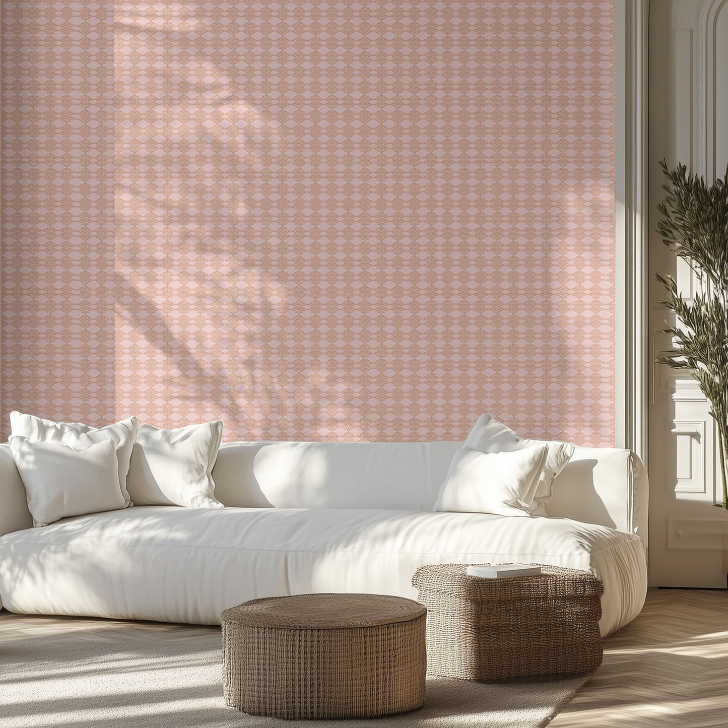Living room with white sofa, peach and pink patterned wallpaper on the wall.