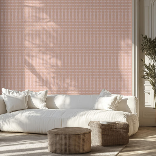 Living room with white sofa, peach and pink patterned wallpaper on the wall.