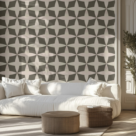 Modern living room with neutral geometric wallpaper, white sofa, and wicker ottomans.