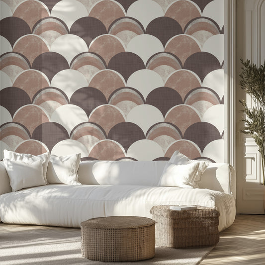 Living room with a brown, textured wallpaper patterned wall, white sofa, and wicker ottomans.