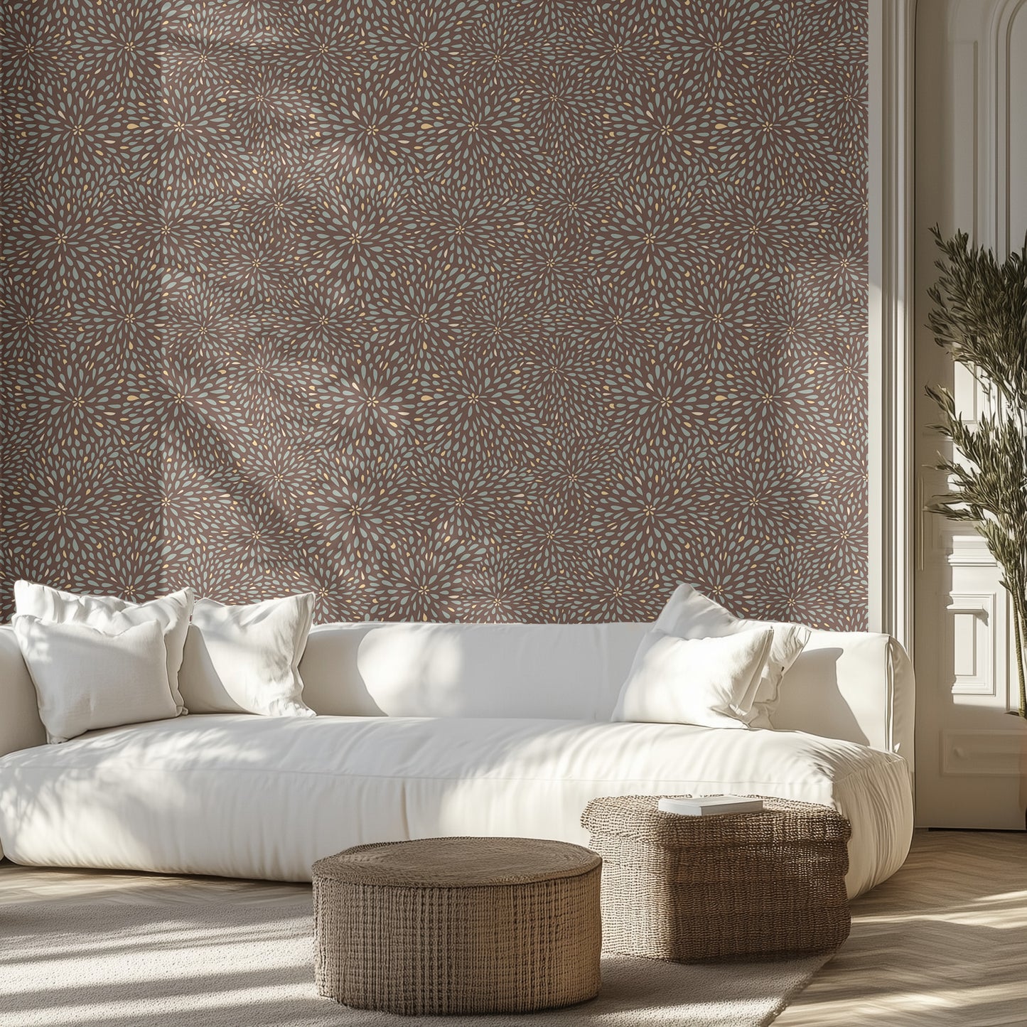 Modern living room with a white sofa, brown and teal floral burst patterned wallpaper, and decorative items.