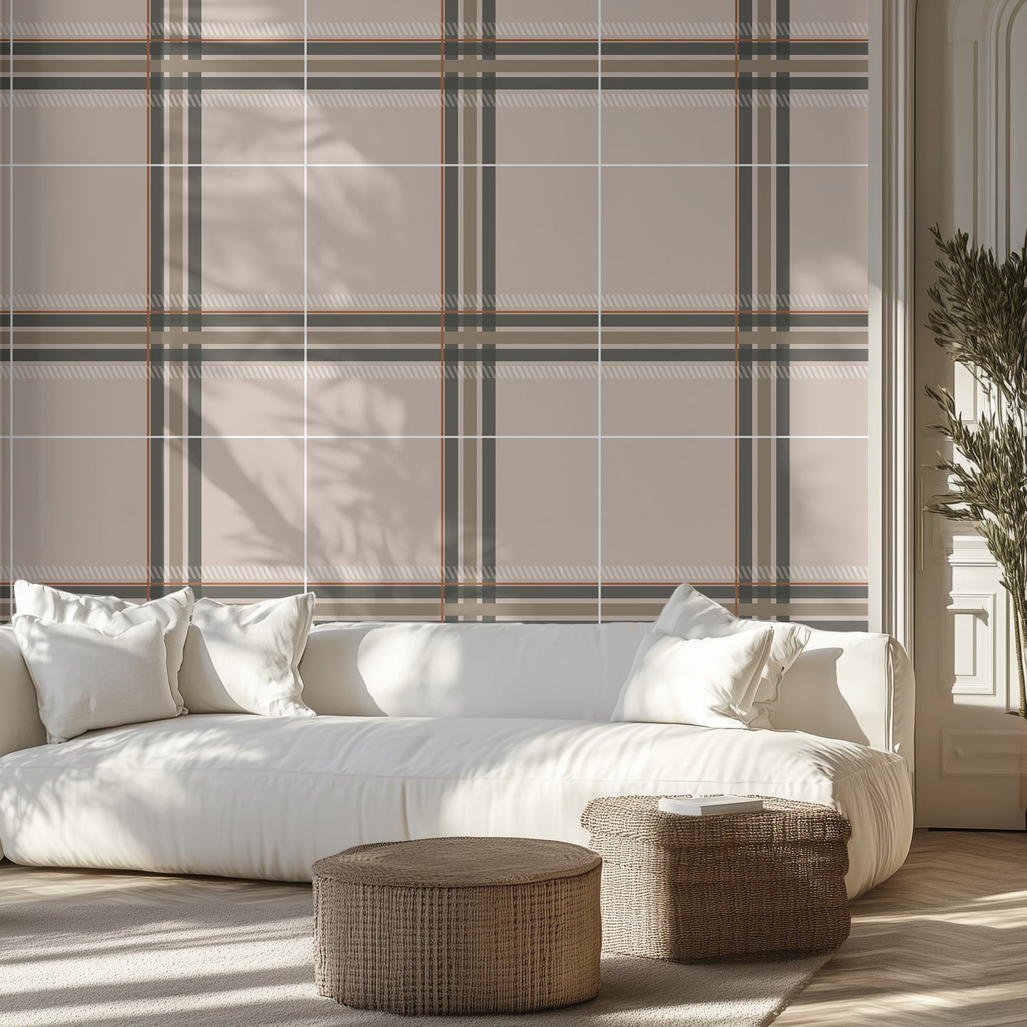 Modern living room with a white sofa, sophisticated neutral plaid wallpaper design on the wall, and wicker ottomans.