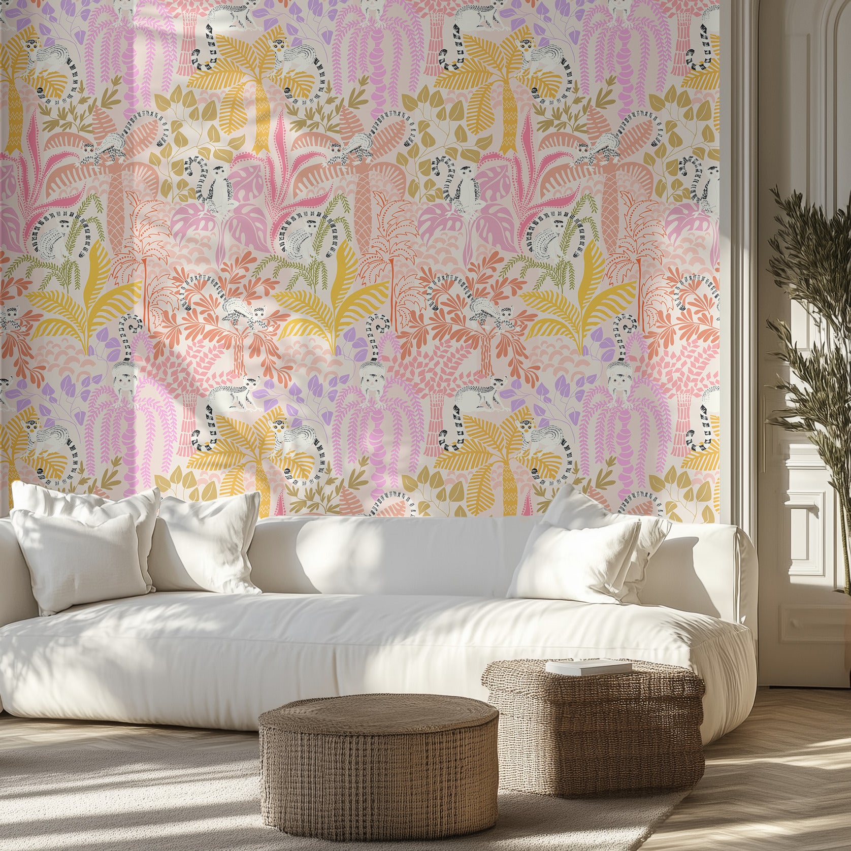 Living room with a white sofa, wicker ottomans, and pink, purple, and yellow lemur-patterned wallpaper.