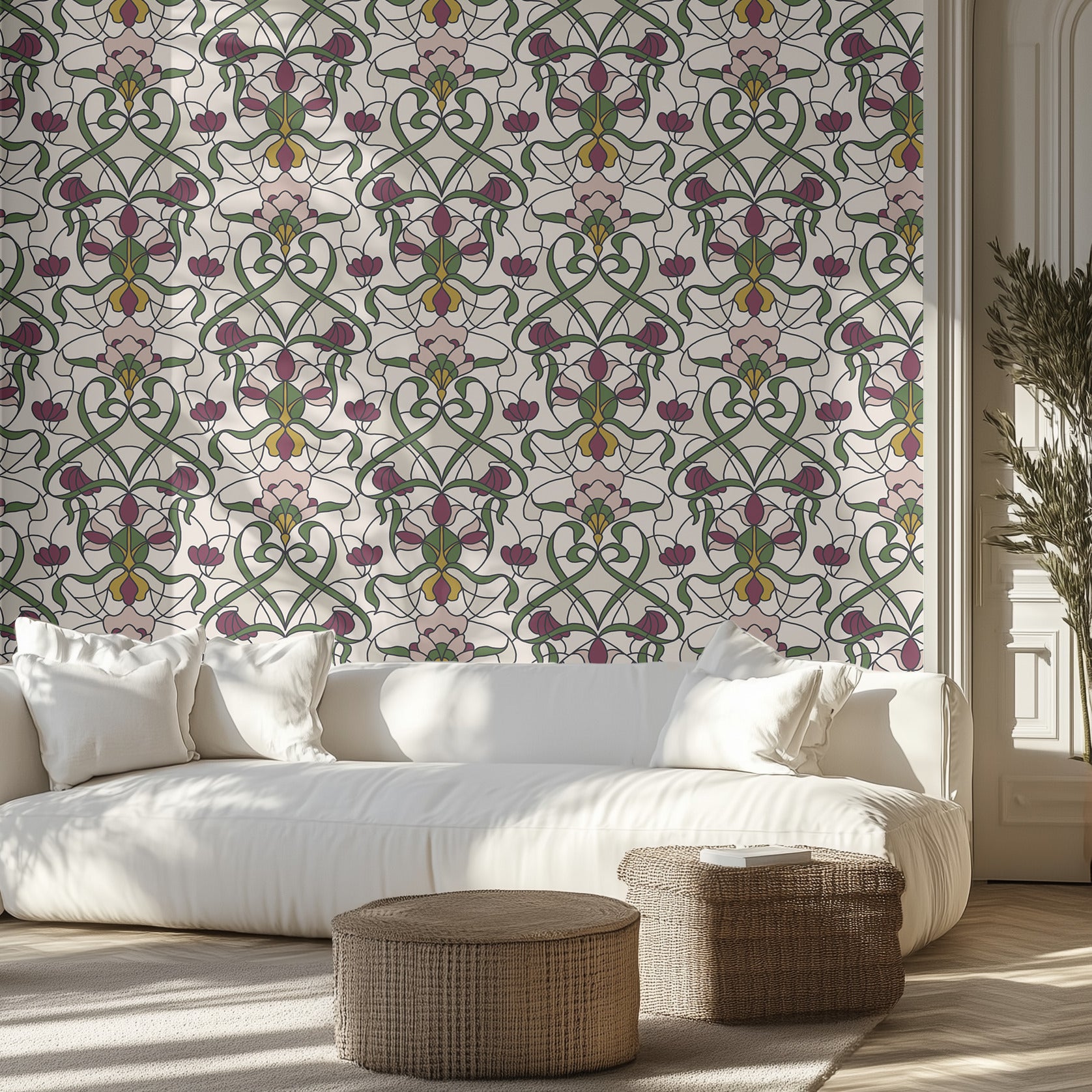 Living room with a cream and floral stained glass patterned wall, white sofa, and decorative ottomans.