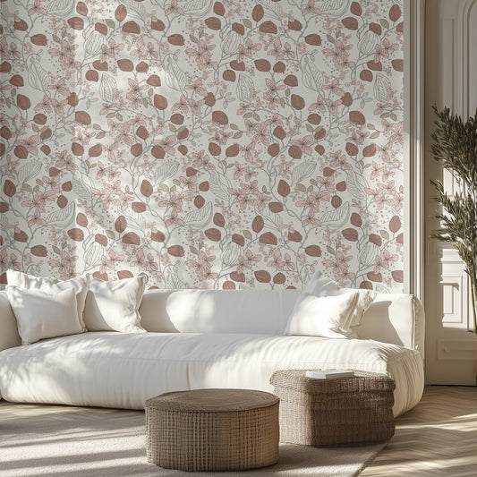 Living room with warm brown and cream floral wallpaper, white sofa, and wicker ottomans.