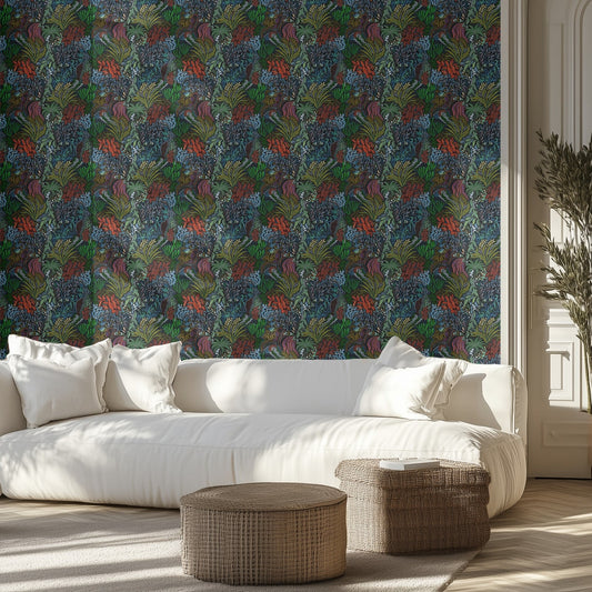 Living room with a white sofa, dark botanical patterned wall, and wicker ottomans.