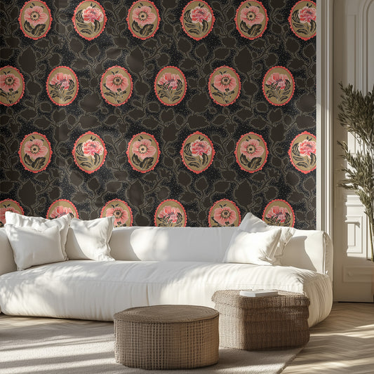 Living room with pink floral wallpaper on black background, white sofa, and wicker ottomans.