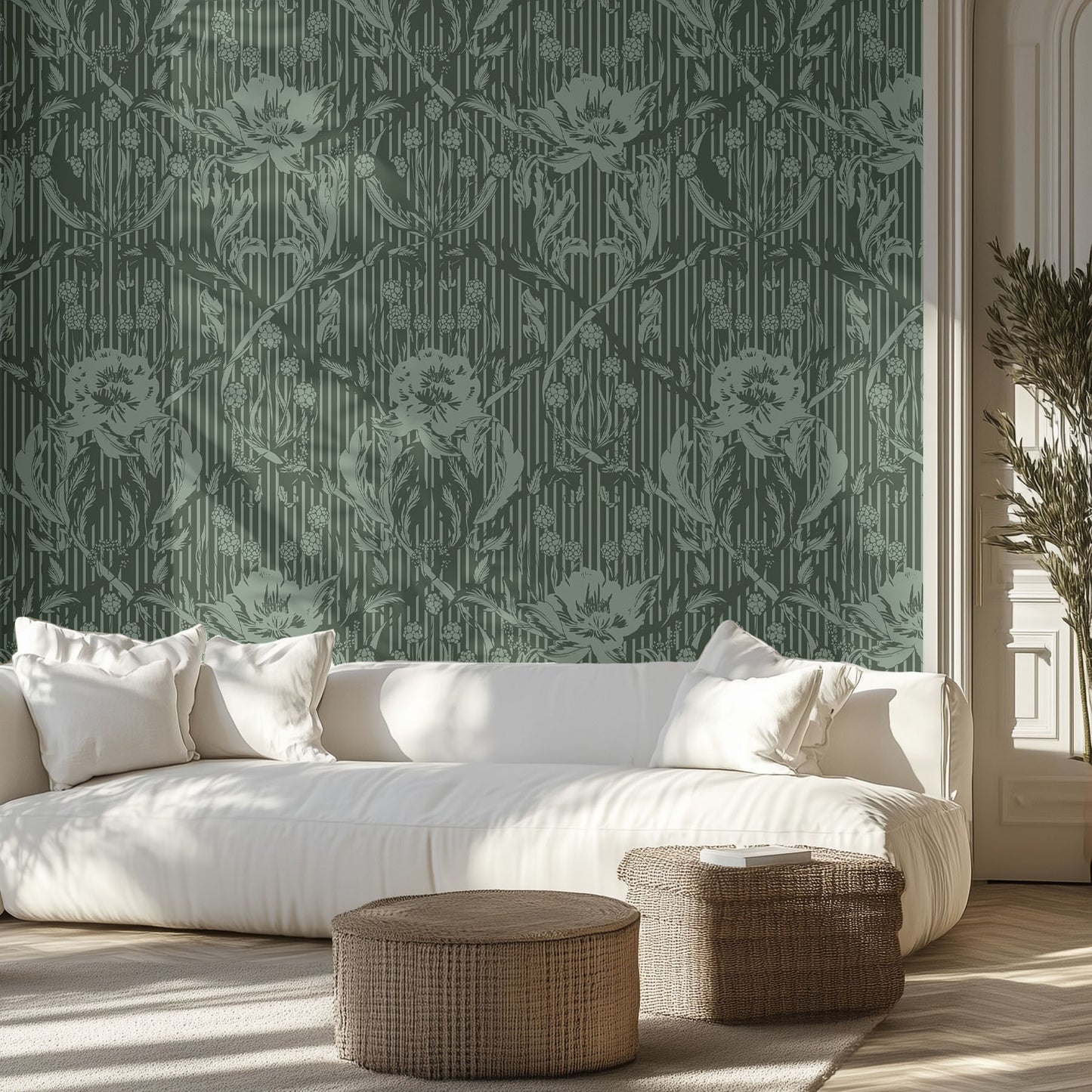 Living room with white sofa, patterned green floral wallpaper, and wicker ottomans.