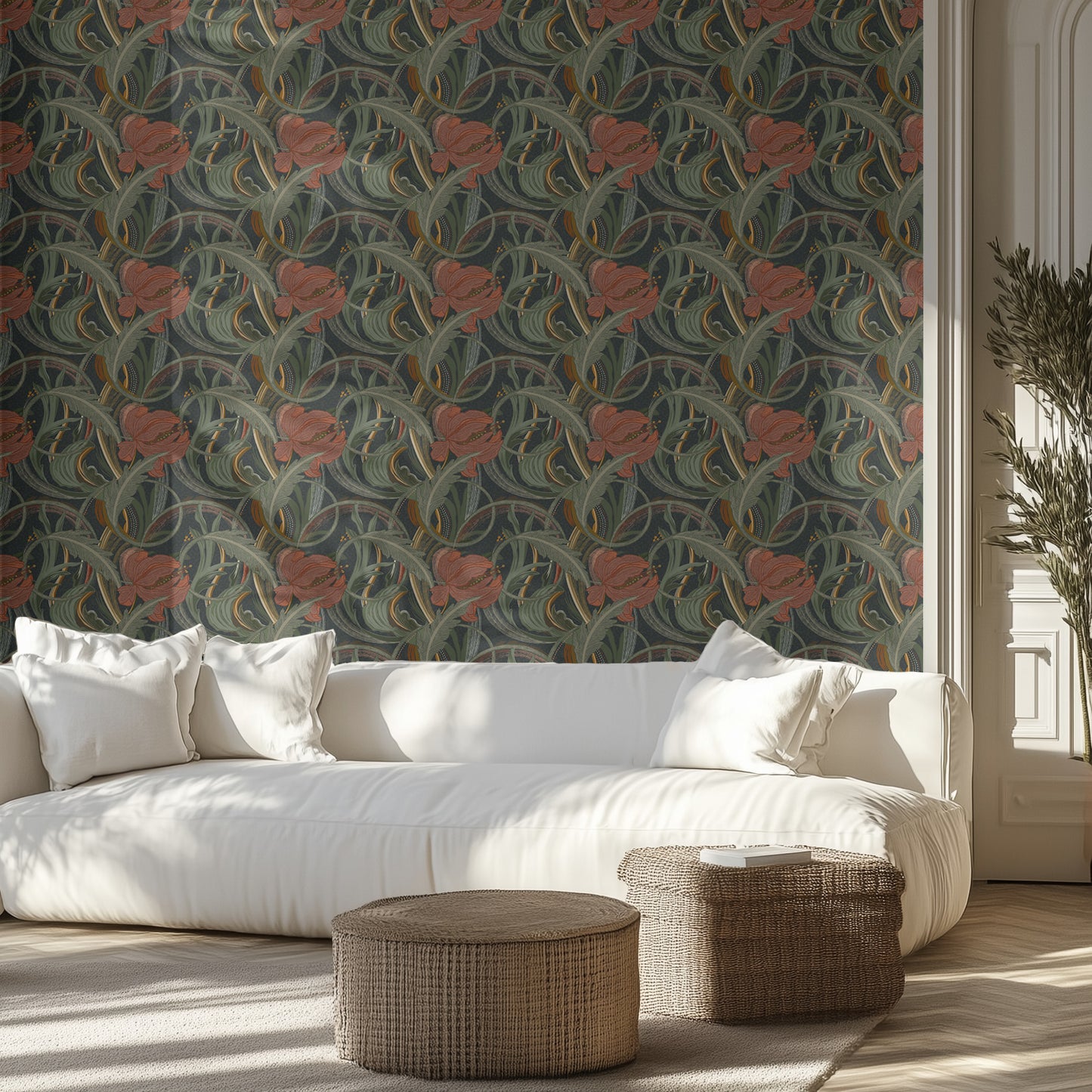 Living room with dark art nouveau floral wallpaper, white sofa, and wicker ottomans.