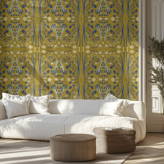 Living room with a white sofa, patterned olive green and blue wall, and wicker ottomans.