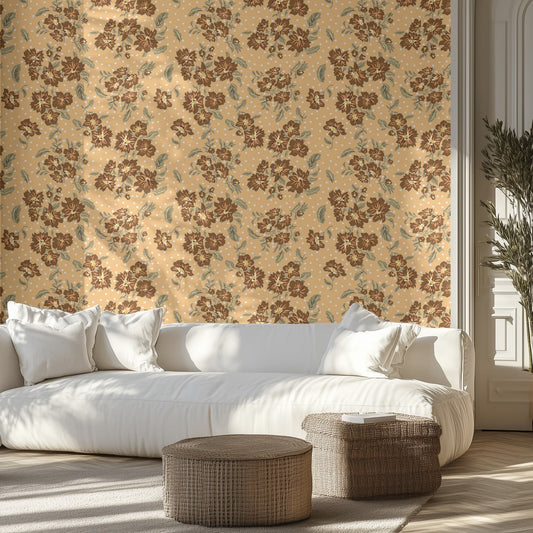 Living room with brown and golden yellow floral wallpaper, white sofa, and wicker ottomans.