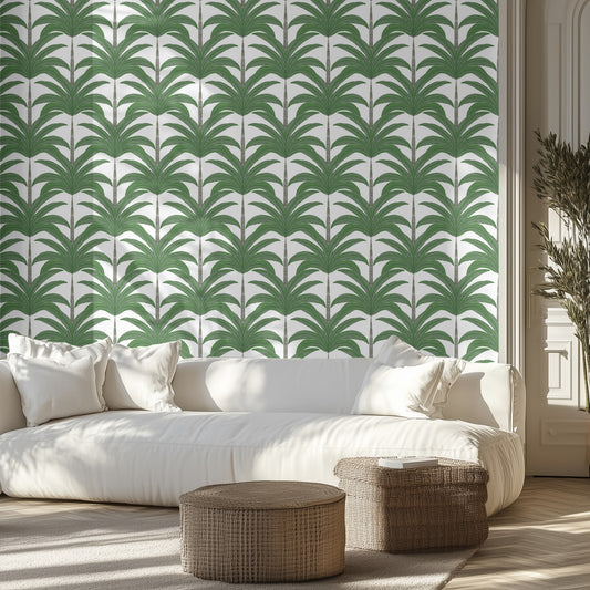 Living room with green palm wallpaper, white sofa, and wicker ottomans.