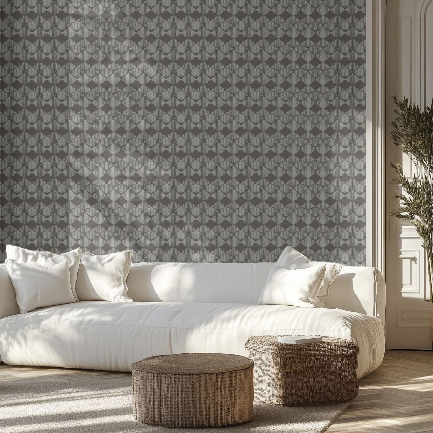 Modern living room with a white sofa, geometric boho patterned wallpaper, and decorative items.
