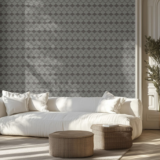 Modern living room with a white sofa, geometric boho patterned wallpaper, and decorative items.