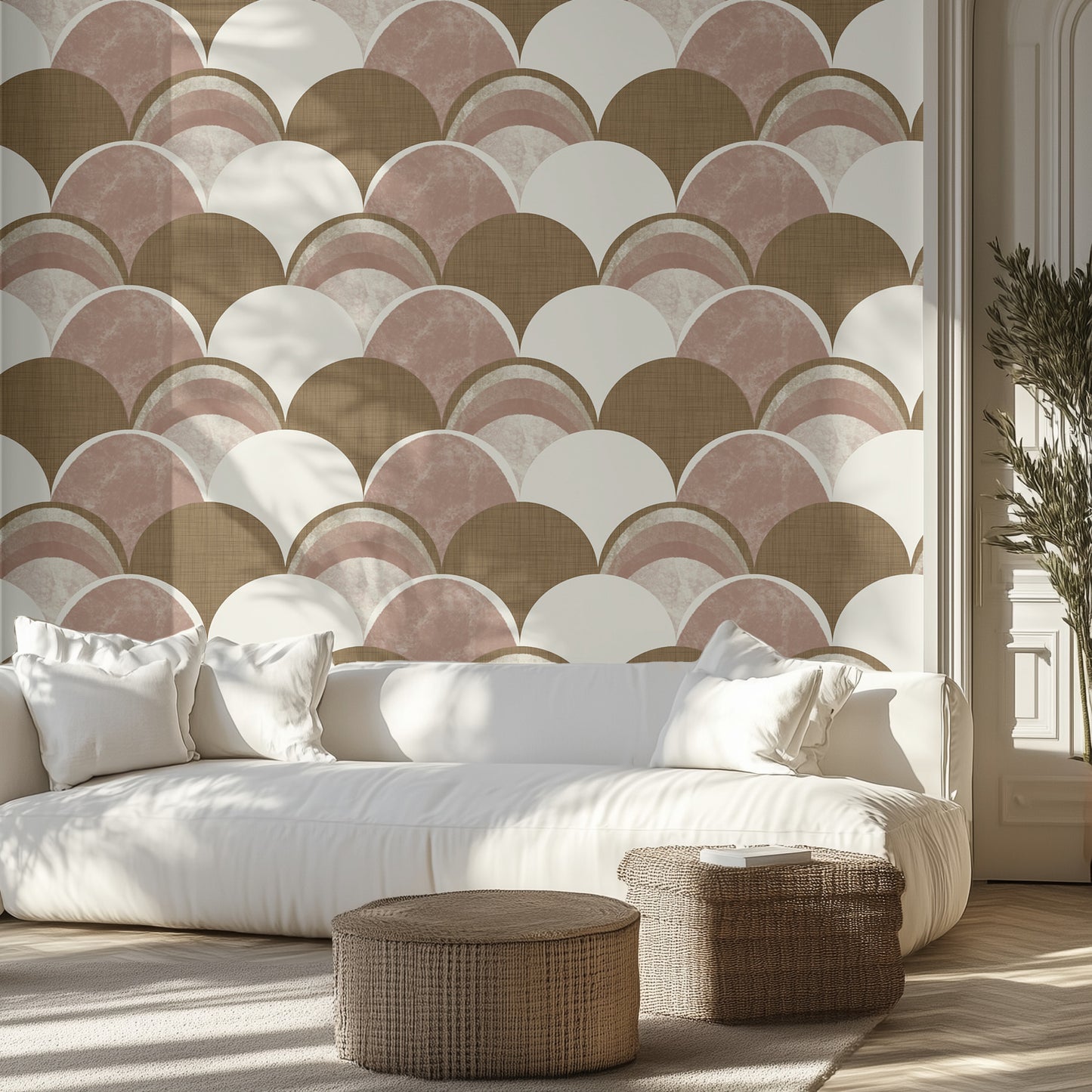Living room with a neutral scalloped shape patterned wall, white sofa, and wicker ottomans.