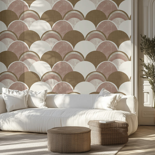 Living room with a neutral scalloped shape patterned wall, white sofa, and wicker ottomans.
