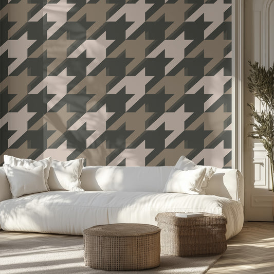 Living room with a white sofa, neutral houndstooth patterned wall, and wicker ottomans.