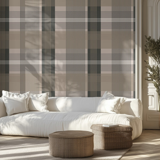 Modern living room with a white sofa, beige and dark taupe plaid wallpaper, and wicker ottomans.
