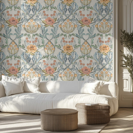 Living room with light pink, aqua, and light blue ornate floral wallpaper, white sofa, and wicker ottomans.