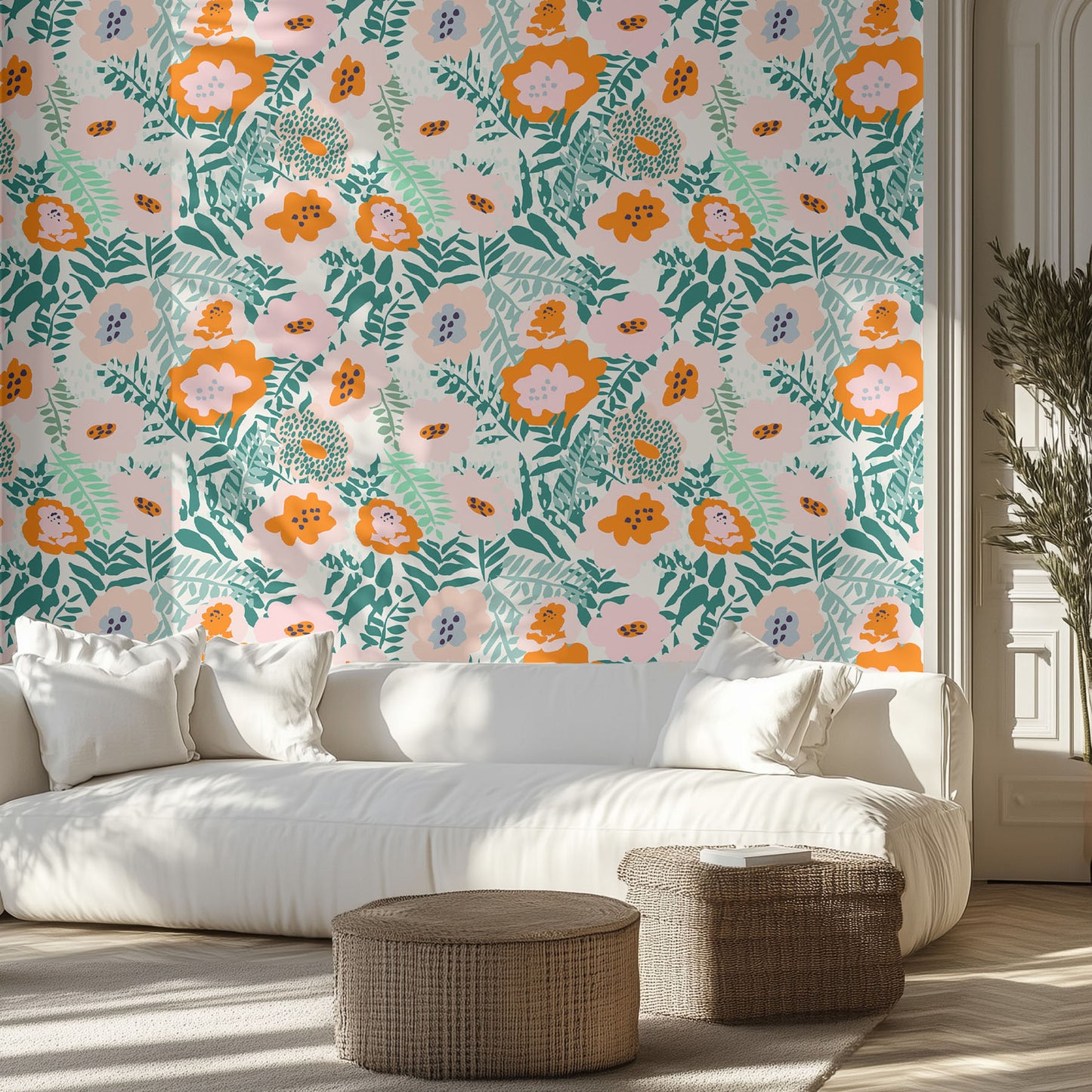 Living room with vibrant, colorful, floral wallpaper, white sofa, and wicker ottomans.
