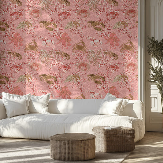 Living room with white sofa, ocean themed patterned pink wall, and wicker ottomans.