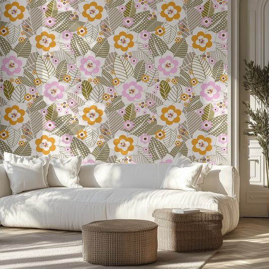 Living room with floral wallpaper, white sofa, and wicker ottomans.