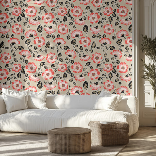 Living room with pink and beige floral wallpaper, white sofa, and wicker ottomans.