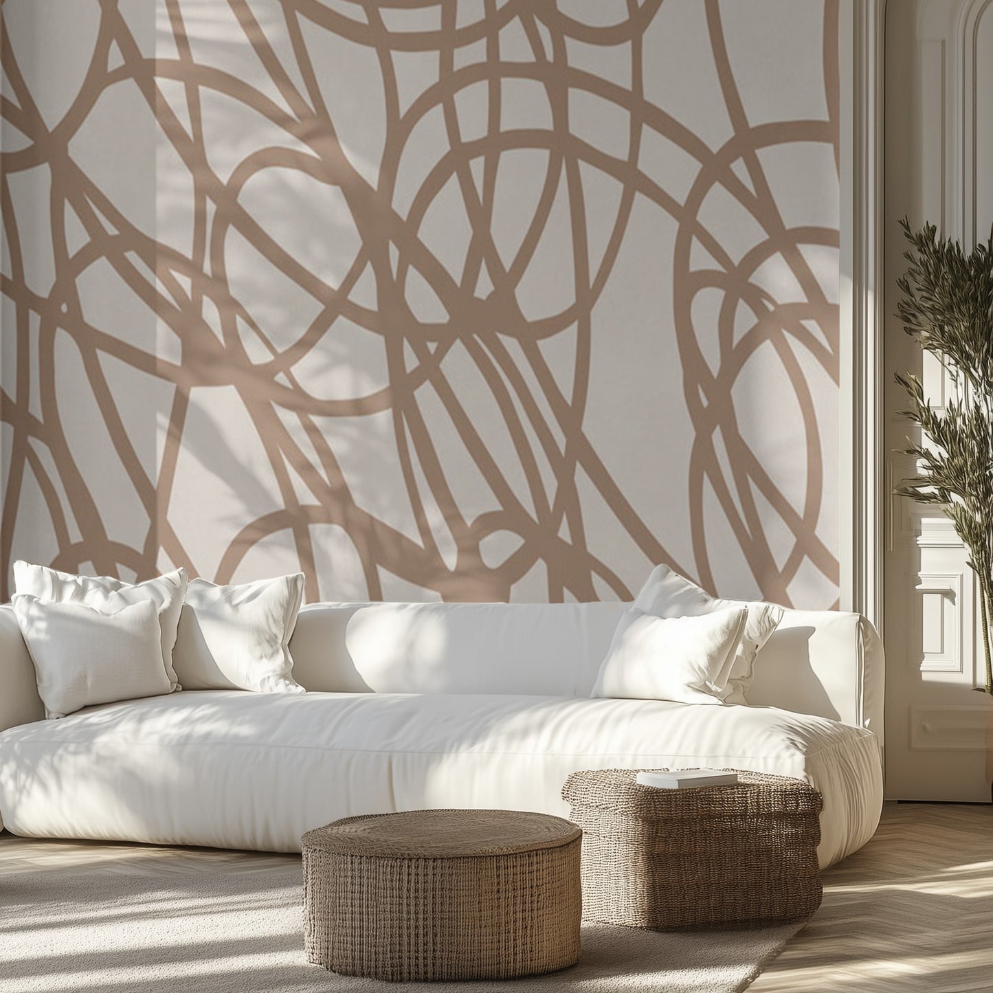 Modern living room with a white sofa, wicker ottomans, and brown line art wall mural.