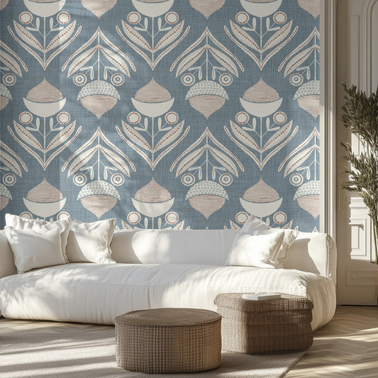 Living room with a blue and cream textured patterned wall, white sofa, and decorative ottomans.